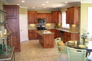 Large u-shaped ceramic tile eat-in kitchen photo in Cleveland with dark wood cabinets, granite countertops, stainless steel appliances and an island