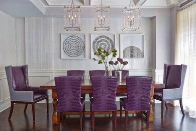 Photo of a transitional separate dining room in New York with dark hardwood floors and grey walls.