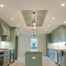 Muted green kitchens