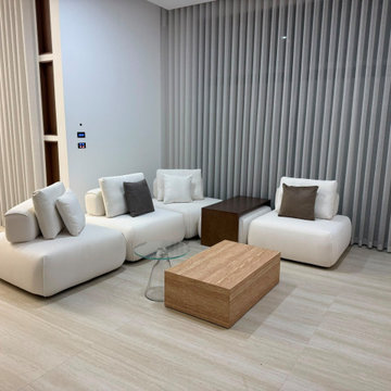 Spacious Open Plan Living Room with Modular White Sofa & Vertical Sheer Curtains