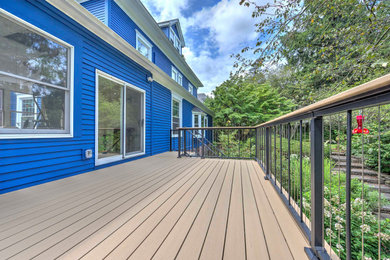 Deck - large backyard second story metal railing deck idea in Other with no cover