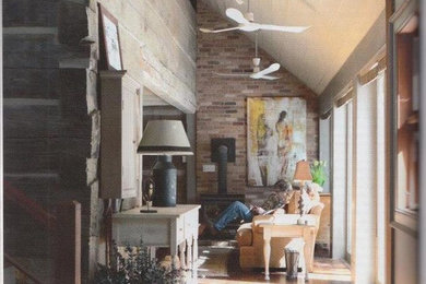 Inspiration for a large rustic dark wood floor hallway remodel in Toronto with beige walls