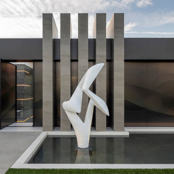 Serenity Indian Wells modern luxury home with Richard Erdman entry sculpture