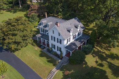 Example of a farmhouse exterior home design in Philadelphia