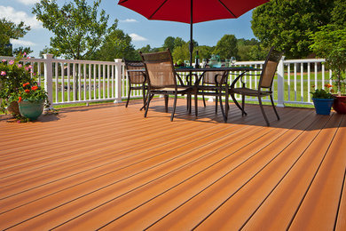 Example of a mid-sized classic backyard deck design in Birmingham with no cover