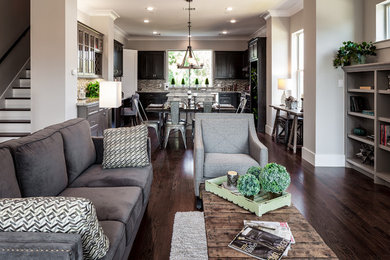 Inspiration for a large transitional open concept living room in Houston with dark hardwood floors.