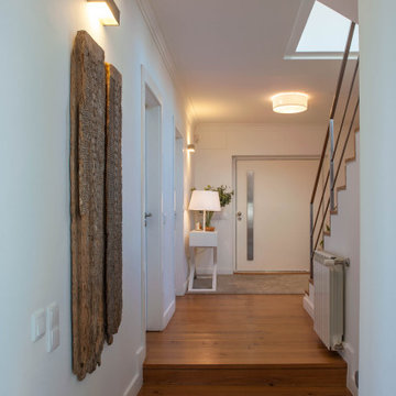 Birre Hall with Aged Wood Panels and Stair Access