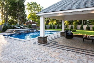 Design ideas for a large modern backyard patio in New York with a water feature, concrete pavers and a gazebo/cabana.