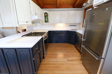 Inspiration for a timeless eat-in kitchen remodel in Boston with an island