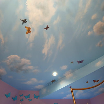 Sky Ceiling Mural with Butterflies, hand-painted in a bedroom by Mural Art LLC.