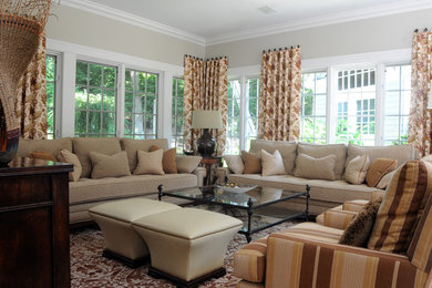 Large transitional enclosed family room photo in New York with beige walls, no fireplace and no tv