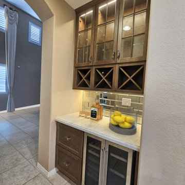 Chic Wine Station with Under-Cabinet Lighting and Beverage Cooler