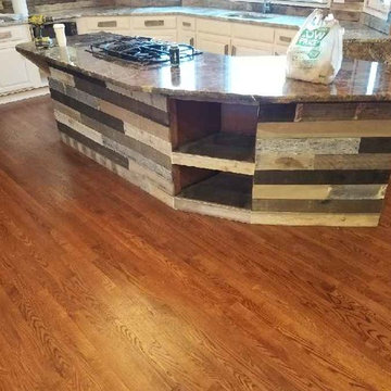 Custom Barnwood backsplash, kitchen accents, door and lighiting