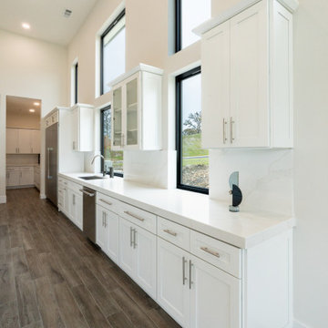 Modern White Shaker Kitchen with Oversized Island & Custom Storage Solutions