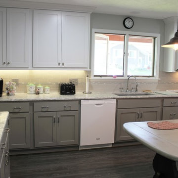 White Upper Cabinet and Gray Base Cabinet Kitchen With Quartz Counters