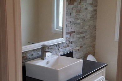 Example of a transitional home design design in Toronto