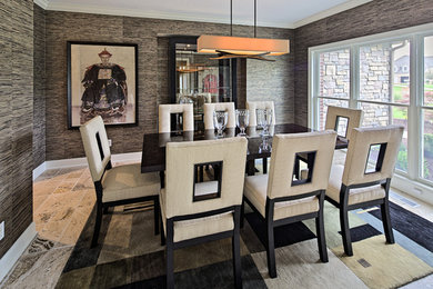 This is an example of a mid-sized eclectic separate dining room in Chicago with brown walls, travertine floors, no fireplace and beige floor.