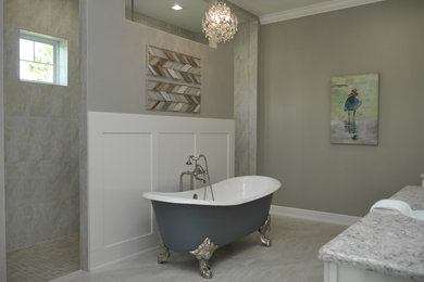 Inspiration for a large craftsman master beige tile and limestone tile ceramic tile and gray floor bathroom remodel in Tampa with flat-panel cabinets, white cabinets, a two-piece toilet, gray walls, a drop-in sink, laminate countertops and gray countertops