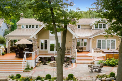Large traditional house exterior idea in Milwaukee