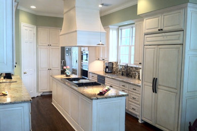 This is an example of a large traditional kitchen in Houston.