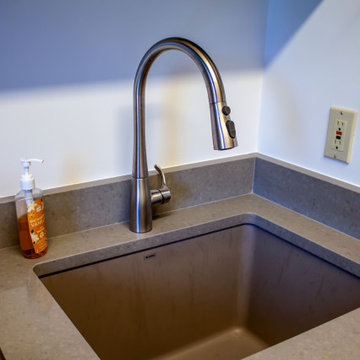 Laundry Room with Custom Cabinetry Quartz Countertop and Custom Floating Shelf