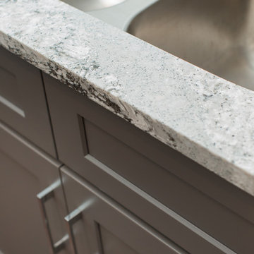 Kitchen | Two-Tone Cabinets | Cambria Quartz | Arabesque Marble Backsplash