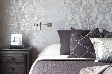 Example of a trendy master light wood floor bedroom design in Sacramento with gray walls