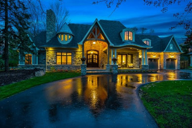 Huge elegant beige two-story brick exterior home photo in Toronto with a shingle roof