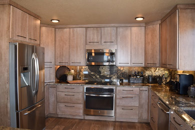Mid-sized transitional u-shaped ceramic tile open concept kitchen photo in Other with a single-bowl sink, flat-panel cabinets, light wood cabinets, granite countertops, multicolored backsplash, stone slab backsplash and stainless steel appliances
