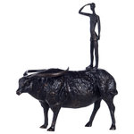 StyleCraft - Dann Foley Lifestyle Battle Ride Black Finish - Make a bold statement with this battle ride sculpture. The bull is shaped in an animated stance that gives it a lifelike appearance, a slim stick figuring perched on its back as if riding into battle.