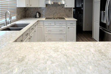 Enclosed kitchen - mid-sized modern u-shaped enclosed kitchen idea in Other with beaded inset cabinets, white cabinets, quartz countertops, multicolored backsplash, no island and multicolored countertops