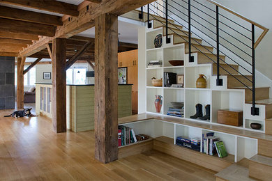 Eclectic wooden l-shaped staircase photo in Portland Maine with wooden risers