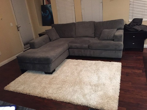 Is this rug too small for the living room?