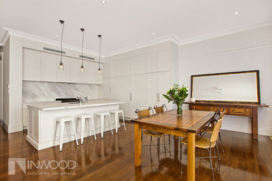 Contemporary kitchen in Sydney with shaker cabinets, white cabinets, marble benchtops and with island.