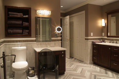 Design ideas for a large transitional master bathroom in New York with shaker cabinets, dark wood cabinets, brown tile, glass tile, an integrated sink, quartzite benchtops and brown walls.