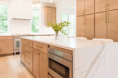 Eat-in kitchen - mid-sized contemporary l-shaped light wood floor eat-in kitchen idea in Baltimore with shaker cabinets, white backsplash, ceramic backsplash, stainless steel appliances, an island and white countertops