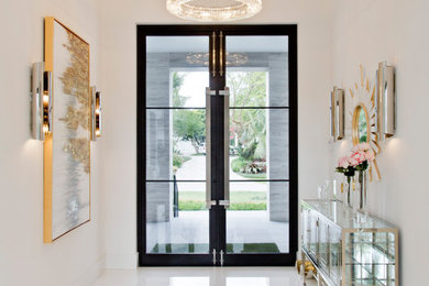 Mid-sized beach style front door in Miami with white walls, ceramic floors, a double front door, a black front door and white floor.