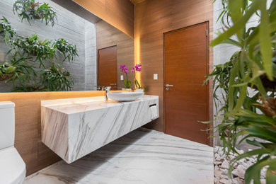 Bathroom - contemporary marble floor bathroom idea in Other with marble countertops