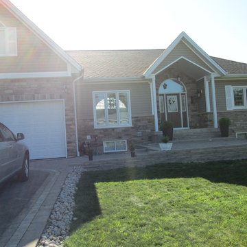 Updating an aluminum siding exterior using cultured stone veneer