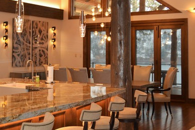 Inspiration for a mid-sized industrial u-shaped medium tone wood floor and brown floor open concept kitchen remodel in Seattle with a farmhouse sink, beaded inset cabinets, medium tone wood cabinets, granite countertops, multicolored backsplash, stone tile backsplash, stainless steel appliances and an island