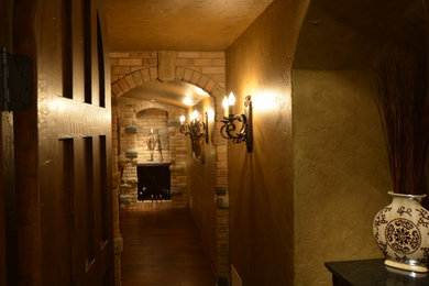 Wine cellar - large mediterranean wine cellar idea in Milwaukee with diamond bins
