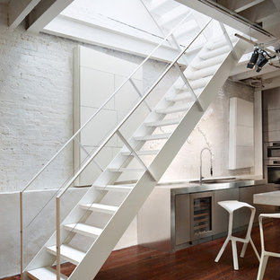 Medium sized urban metal straight metal railing staircase in New York with open risers.