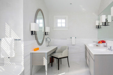 Freestanding bathtub - mid-sized contemporary master beige tile and mosaic tile mosaic tile floor freestanding bathtub idea in New York with flat-panel cabinets, light wood cabinets, white walls and an undermount sink