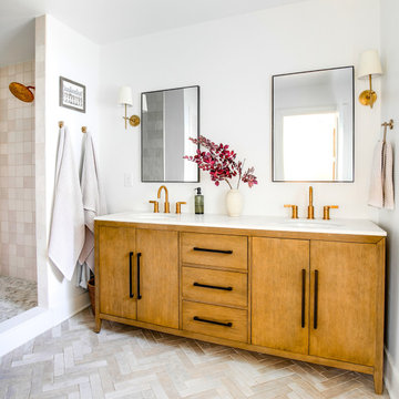 Primary Bath with Herringbone Tile and Brass Accents