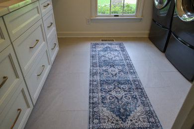 Example of a transitional laundry room design in Cleveland