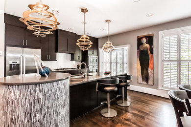 Inspiration for a contemporary kitchen remodel in Other with flat-panel cabinets, dark wood cabinets, stainless steel appliances and an undermount sink