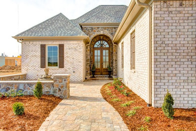 Design ideas for a mid-sized mediterranean drought-tolerant and partial sun front yard stone garden path in Other.