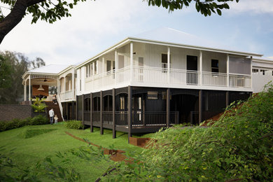 Large traditional two-storey house exterior in Brisbane with mixed siding, a hip roof, a metal roof and a grey roof.