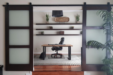 Mid-sized trendy freestanding desk medium tone wood floor study room photo in San Francisco with gray walls