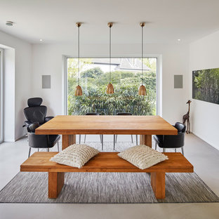 デュッセルドルフの中サイズのコンテンポラリースタイルのLDKの画像 (白い壁、コンクリートの床)